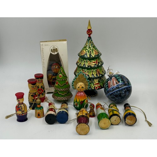 365 - A collection of 20thC Russian and USSR  wooden Matryoshka graduating nests of dolls and other folk a... 