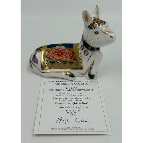 375 - Four Royal Crown Derby paperweights to include Thistle Donkey limited edition 632/1500, Holly Donkey... 