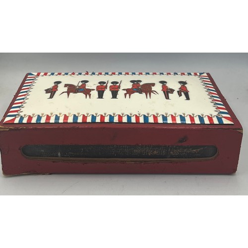 1259 - A leather covered giant match box with enamelled top depicting soldiers and horses. 22cm x 13cm x 5c... 