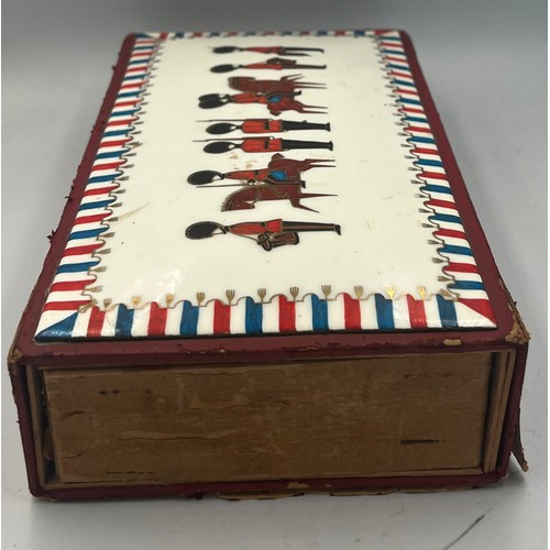 1259 - A leather covered giant match box with enamelled top depicting soldiers and horses. 22cm x 13cm x 5c... 