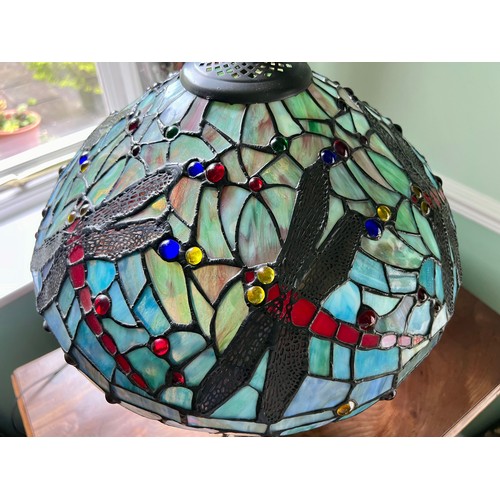 1021 - Tiffany style glass lamp with dragonfly decoration. 60cm h.