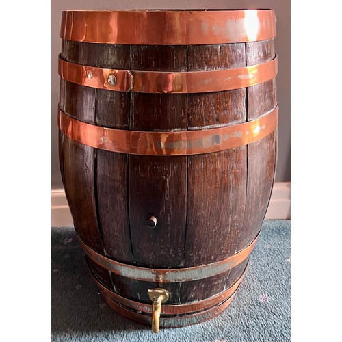 1261 - A vintage oak barrel with copper banding. 55cm h x 32cm to top.