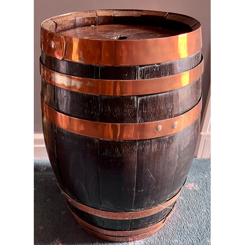 1261 - A vintage oak barrel with copper banding. 55cm h x 32cm to top.