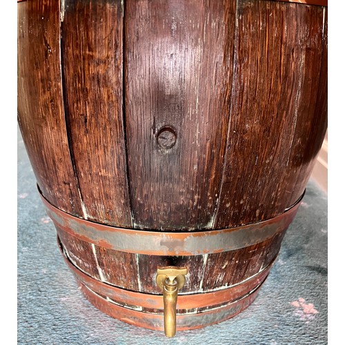 1261 - A vintage oak barrel with copper banding. 55cm h x 32cm to top.