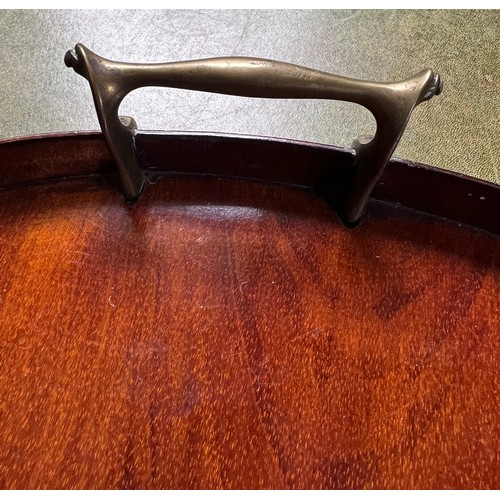 1262 - An Edwardian mahogany kidney shaped tray with shell inlay and brass handles. 56cm w.