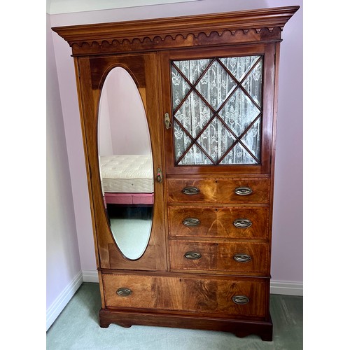 77 - An Edwardian mahogany inlaid wardrobe and dressing table. The wardrobe with single door, 3 short dra... 