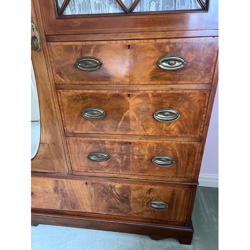 77 - An Edwardian mahogany inlaid wardrobe and dressing table. The wardrobe with single door, 3 short dra... 