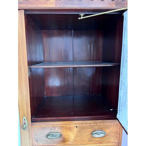 77 - An Edwardian mahogany inlaid wardrobe and dressing table. The wardrobe with single door, 3 short dra... 