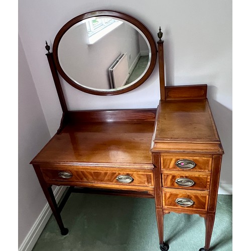 77 - An Edwardian mahogany inlaid wardrobe and dressing table. The wardrobe with single door, 3 short dra... 