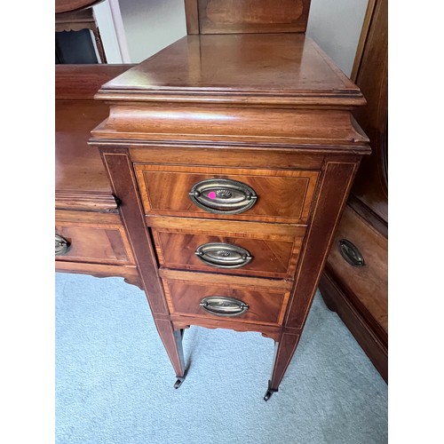 77 - An Edwardian mahogany inlaid wardrobe and dressing table. The wardrobe with single door, 3 short dra... 