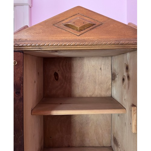 79 - A pine wall mounted cabinet with mirrored door and interior shelf. 53cm h x 27cm d x 36cm w.