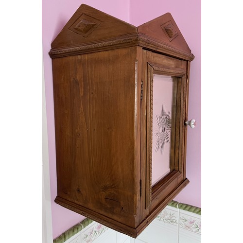 79 - A pine wall mounted cabinet with mirrored door and interior shelf. 53cm h x 27cm d x 36cm w.