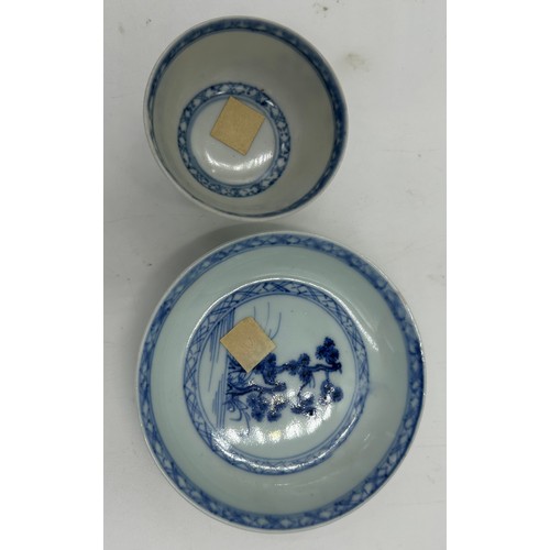 256 - A 18thC Nanking Cargo tea bowl 4cm h and saucer 11.7cm d  with underglaze blue painted decoration of... 