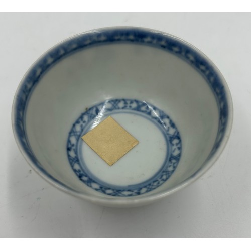 256 - A 18thC Nanking Cargo tea bowl 4cm h and saucer 11.7cm d  with underglaze blue painted decoration of... 