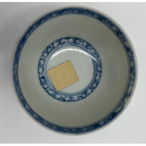 256 - A 18thC Nanking Cargo tea bowl 4cm h and saucer 11.7cm d  with underglaze blue painted decoration of... 