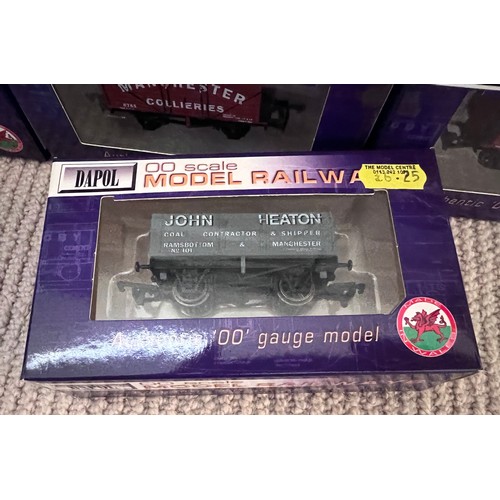 1128 - A large quantity of boxed Dapol OO scale wagons. (22)