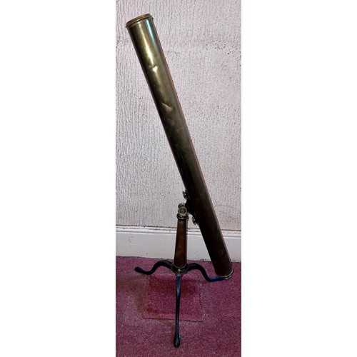 1264 - A brass telescope on cast iron stand.