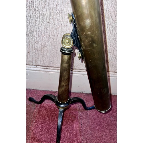 1264 - A brass telescope on cast iron stand.