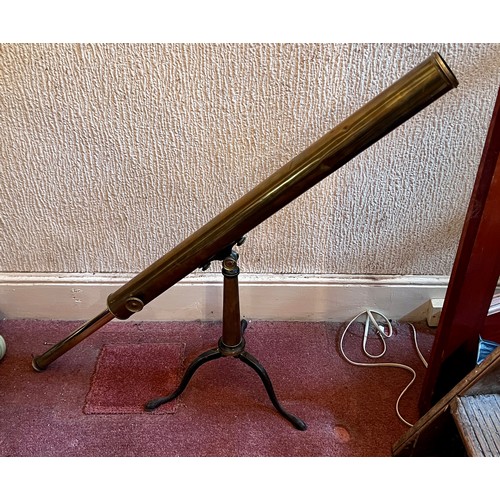 1264 - A brass telescope on cast iron stand.