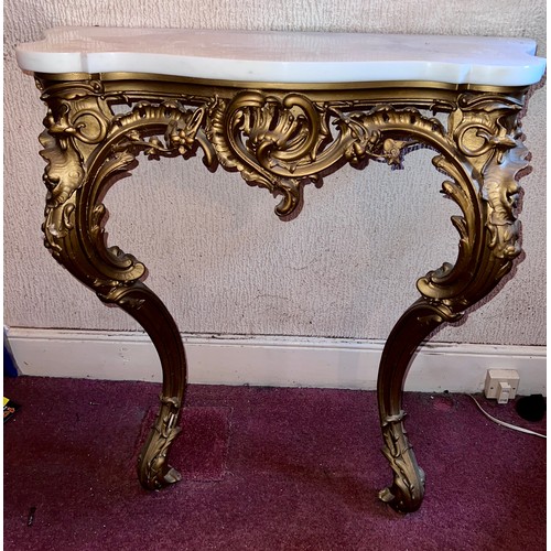 95 - A gilt plaster console table with white marble door. 87 h x 84 w x 39cm h.