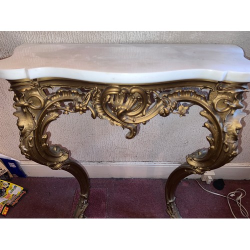 95 - A gilt plaster console table with white marble door. 87 h x 84 w x 39cm h.