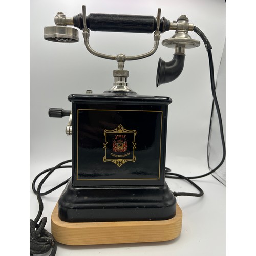 1266 - A Danish Jydsk Telefon Aktieselskab internal extension telephone. 32cm h. Mounted on wooden display ... 