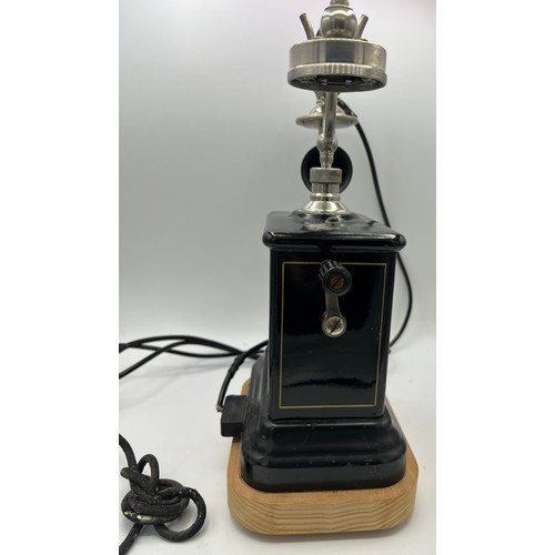 1266 - A Danish Jydsk Telefon Aktieselskab internal extension telephone. 32cm h. Mounted on wooden display ... 