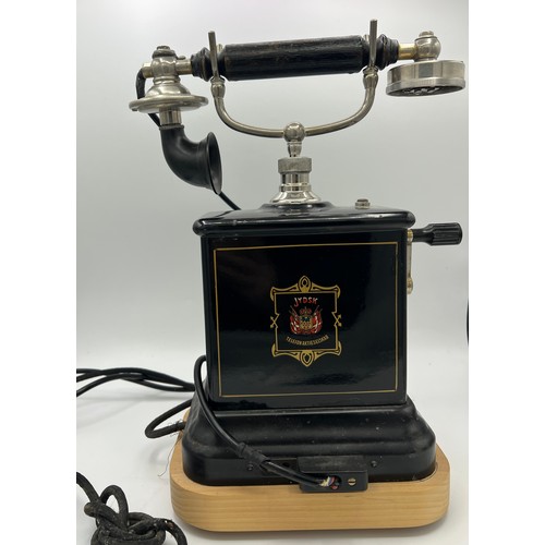 1266 - A Danish Jydsk Telefon Aktieselskab internal extension telephone. 32cm h. Mounted on wooden display ... 