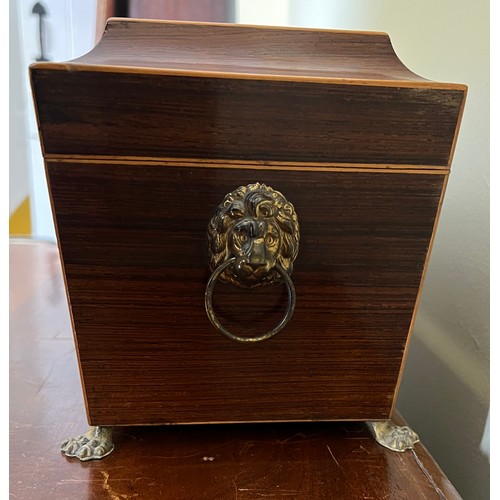 947 - A good quality mahogany and inlaid tea caddy with ivory escutcheon and lions paw feet with lion mask... 