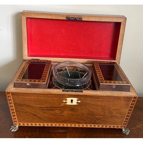 947 - A good quality mahogany and inlaid tea caddy with ivory escutcheon and lions paw feet with lion mask... 