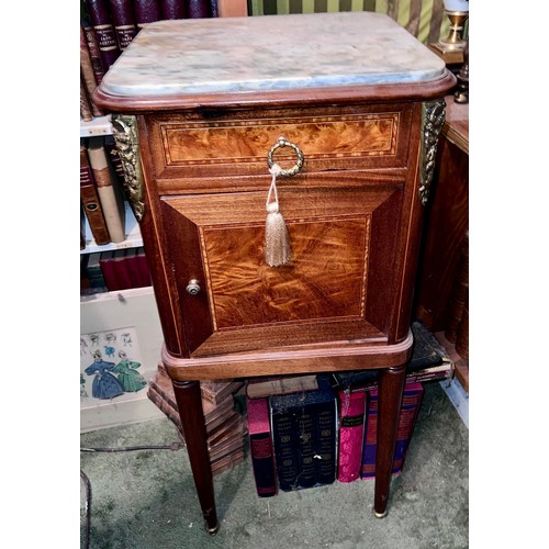 89 - A French inlaid bedside cupboard with marble top and ceramic interior with gilt metal mounts. 87cm x... 