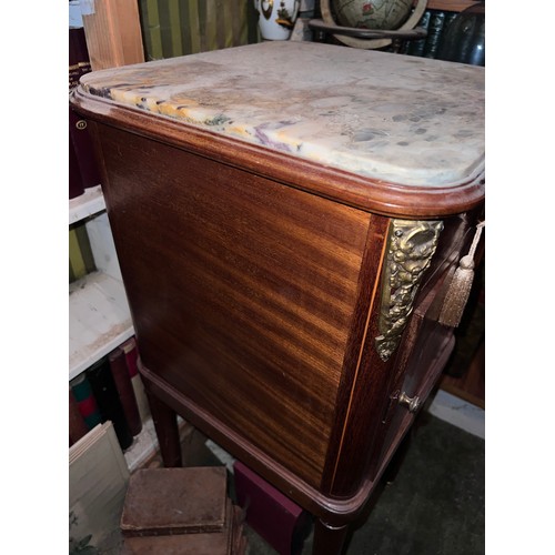 89 - A French inlaid bedside cupboard with marble top and ceramic interior with gilt metal mounts. 87cm x... 