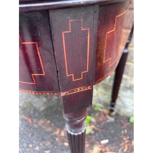 70 - A Gillows mahogany fold over tea table on reeded legs with brass castors. 91cm w x 45cm d x 75cm h. ... 