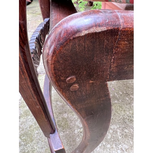 71 - Four Regency rosewood sabre legged dining chairs with brass inlay to back and drop in seats.