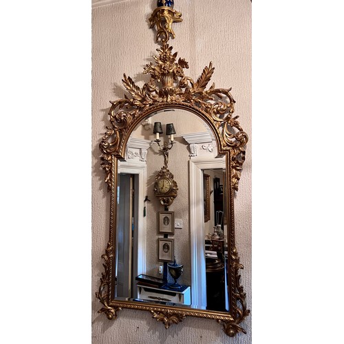 1236 - A 20thC decorative gilt bevel edged wall mirror. 142cm h x 79cm w.