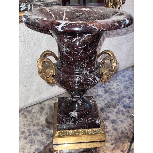 1268 - A marble urn with gilt metal rams head handles. 42cm h x 30cm d to top.