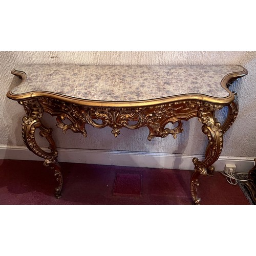 69 - A decorative gilt console table with mirrored top 138cm w x 48cm d x 80cm h.