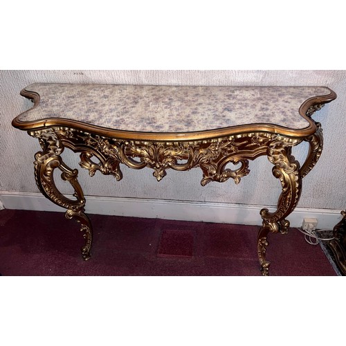 69 - A decorative gilt console table with mirrored top 138cm w x 48cm d x 80cm h.