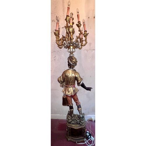 1023 - A decorative gilt figure with 9 branch electrolier to top. 210cm h x 44cm w at base x 30cm d.