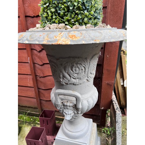 17 - Four cast iron urns on plinths. 85cm h x 46cm d to top.