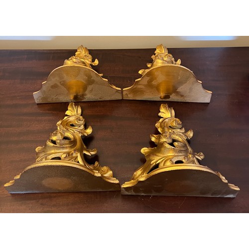 1271 - Four decorative gilt wall mounted brackets. 22cm h.