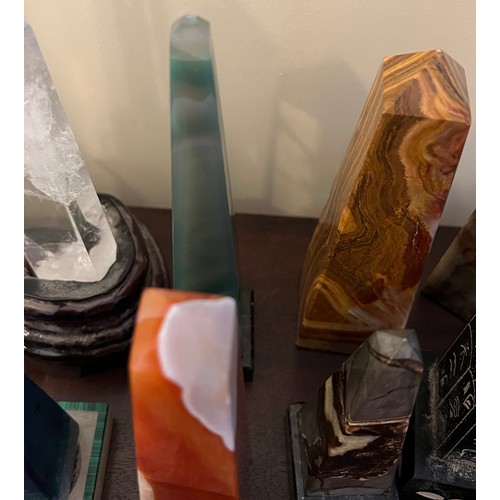 1274 - A collection of agate, glass, brass and granite obelisks and two pyramids. Tallest 30.5cm.