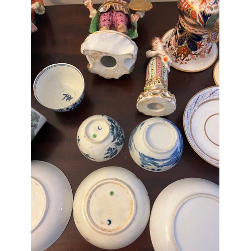 249 - A quantity of 18thC and 19thC English ceramics to include tea bowls, saucers, figurines, pot lid and... 