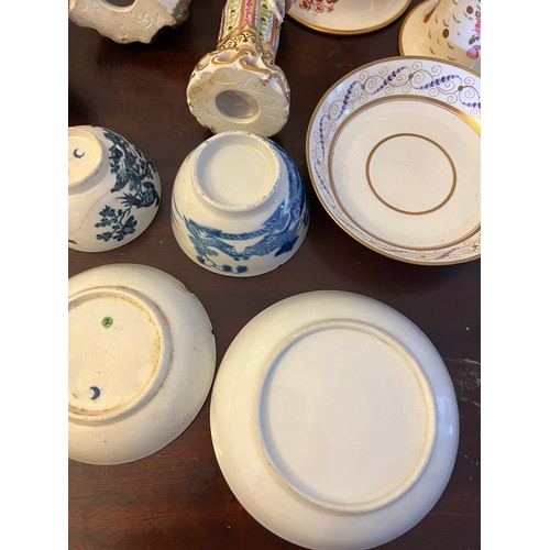 249 - A quantity of 18thC and 19thC English ceramics to include tea bowls, saucers, figurines, pot lid and... 