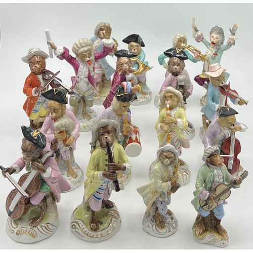 238 - A collection of 17 continental porcelain monkey band figures after Meissen.