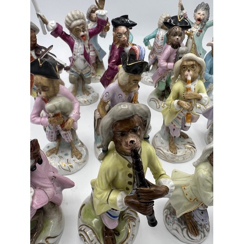 238 - A collection of 17 continental porcelain monkey band figures after Meissen.