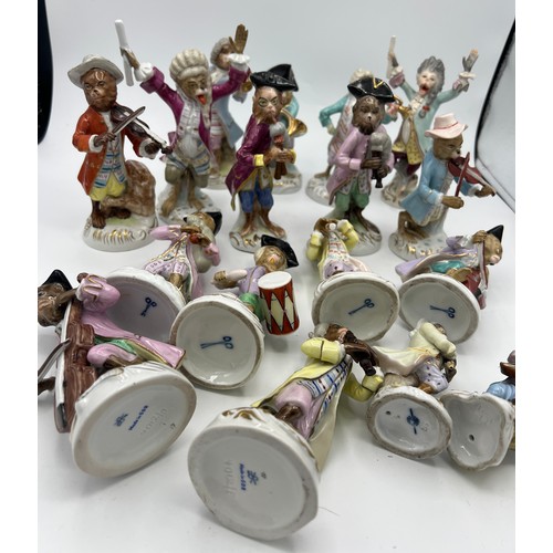 238 - A collection of 17 continental porcelain monkey band figures after Meissen.