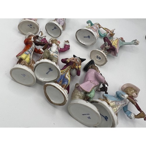 238 - A collection of 17 continental porcelain monkey band figures after Meissen.