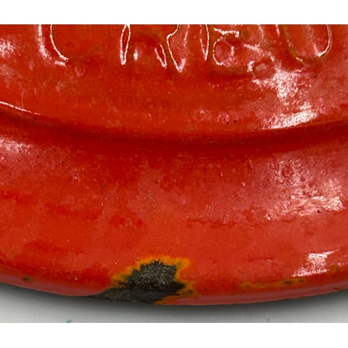 955 - A quantity of Le Creuset volcanic orange to include : three lidded enamelled pans, 22cm, 18cm and 16... 