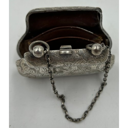 812 - Hallmarked silver purse George Unite London 1889 and a jug raised on three feet Birmingham 1915, mak... 